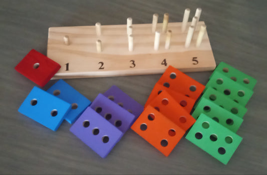 Teach a child to count with geometric shapes with holes on a wooden pegboard