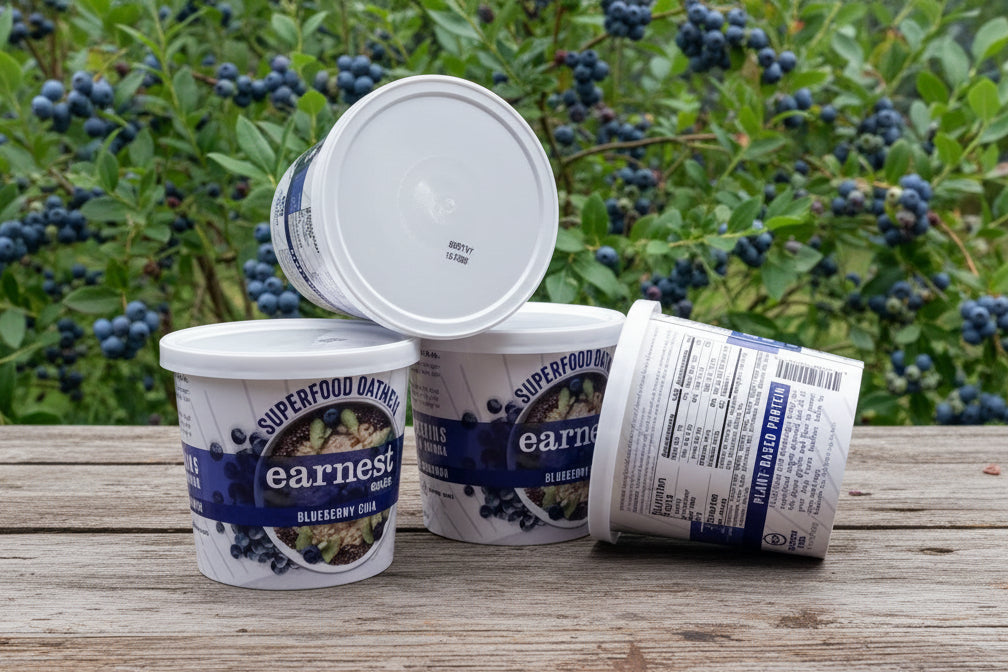Four containers of Earnest Superfood Blueberry on a kitchen counter