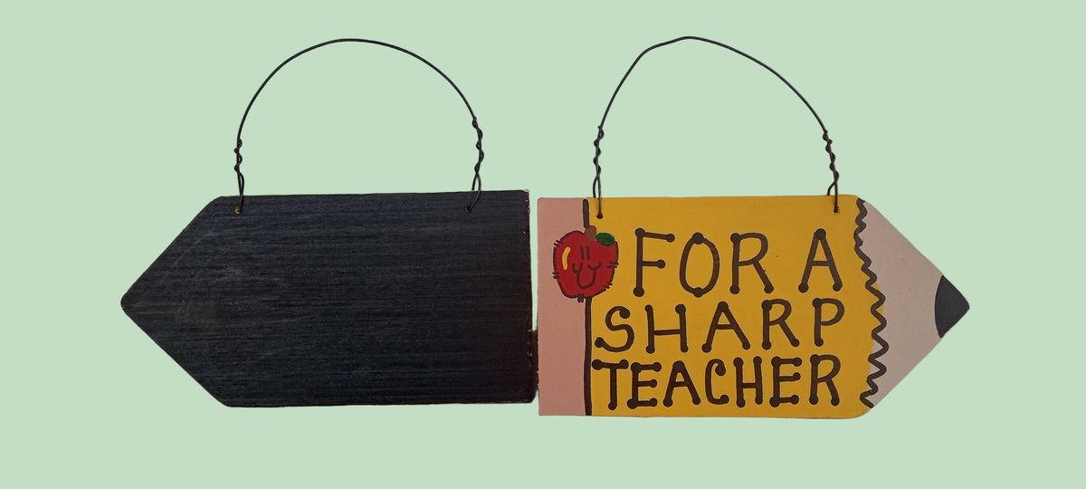 Decorative sign with text 'For a Sharp Teacher' on a white background
