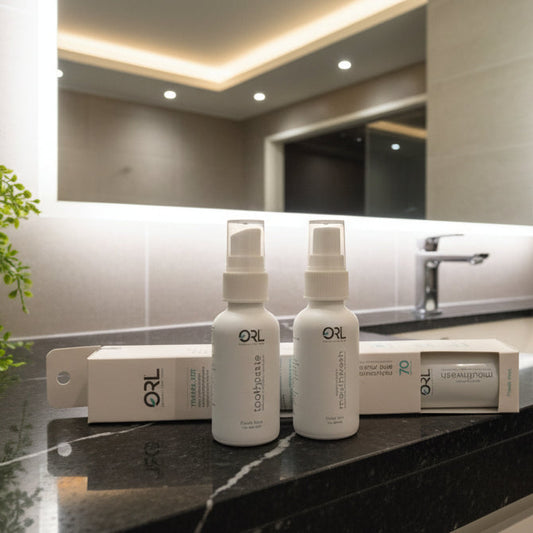 Bathroom counter with bottles and a plant