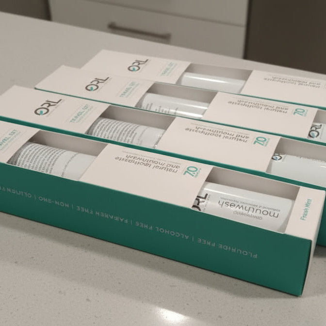 Multiple boxes of a skincare product on a gray surface
