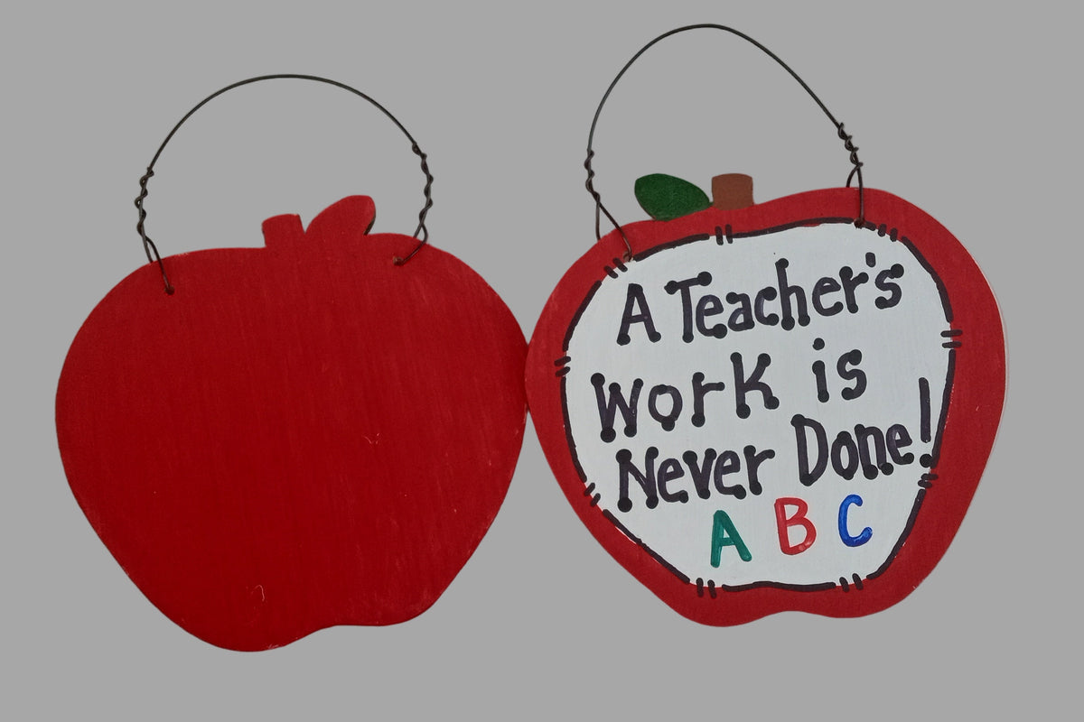 Red apple-shaped sign with text on a white background