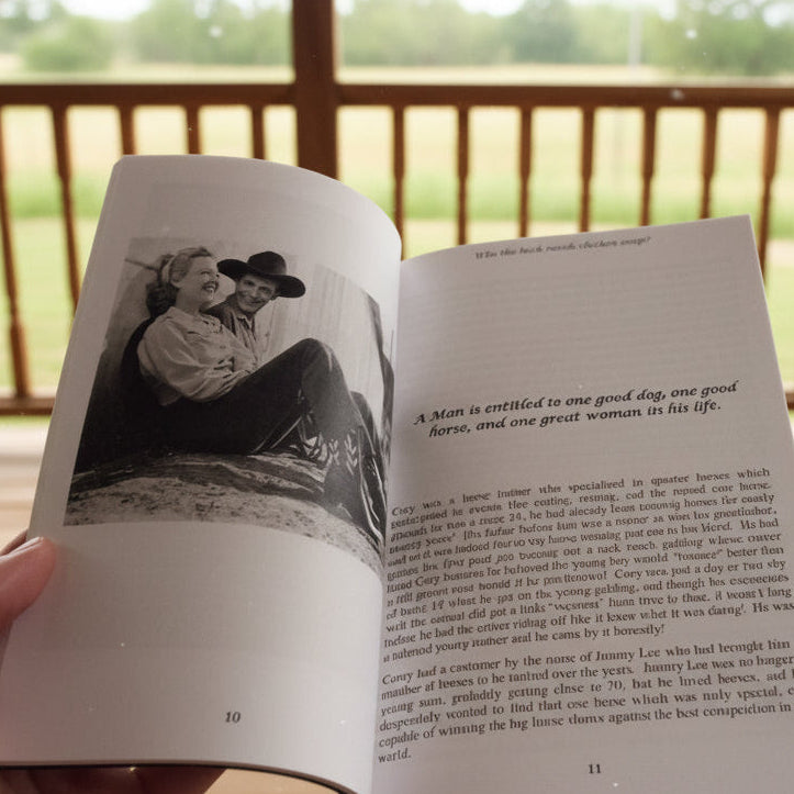 Open book with a photograph and text on a wooden surface